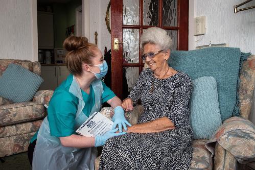 CAH worker laughing with service user